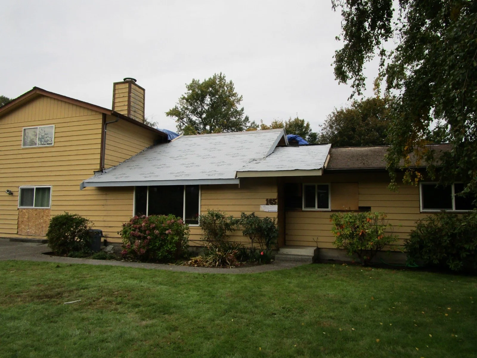 Protective roof membrane on, waiting for final comp roofing.