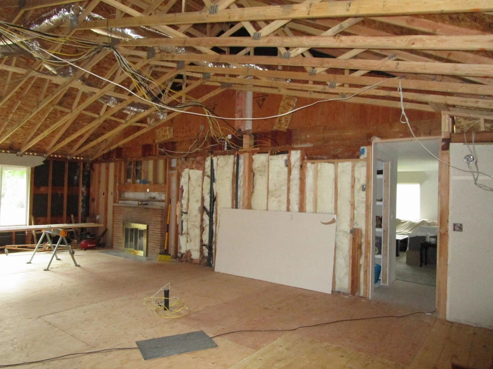 Great Room now with a vaulted ceiling. We are introducing new skylights too.