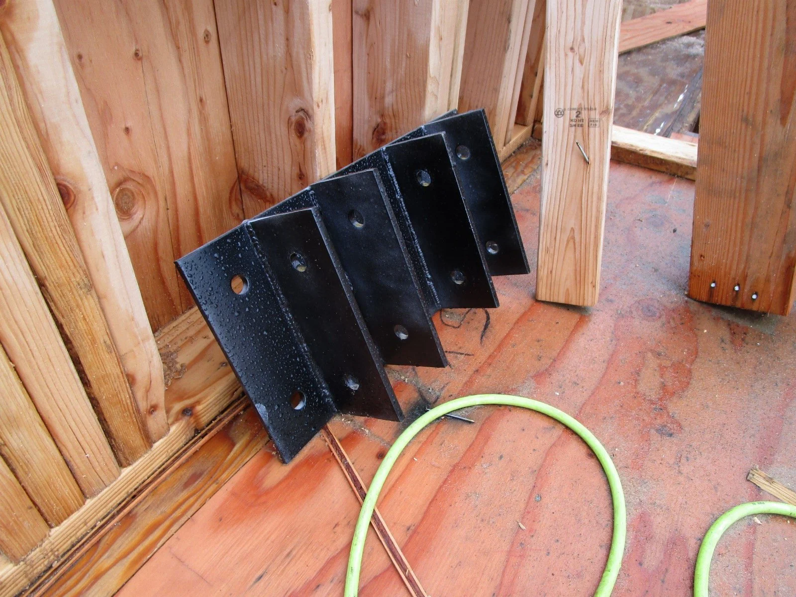 Some of the custom fabricated steel brackets for attaching glu-lams.