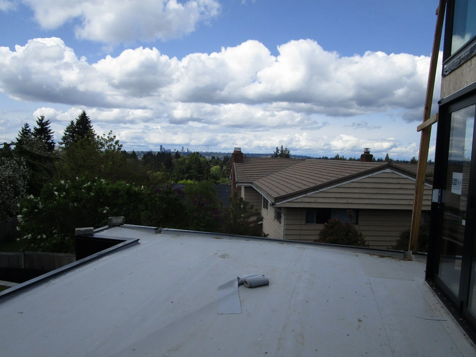 At the deck, a waterproof membrane is going down. An elevated paver system will go down over the membrane.