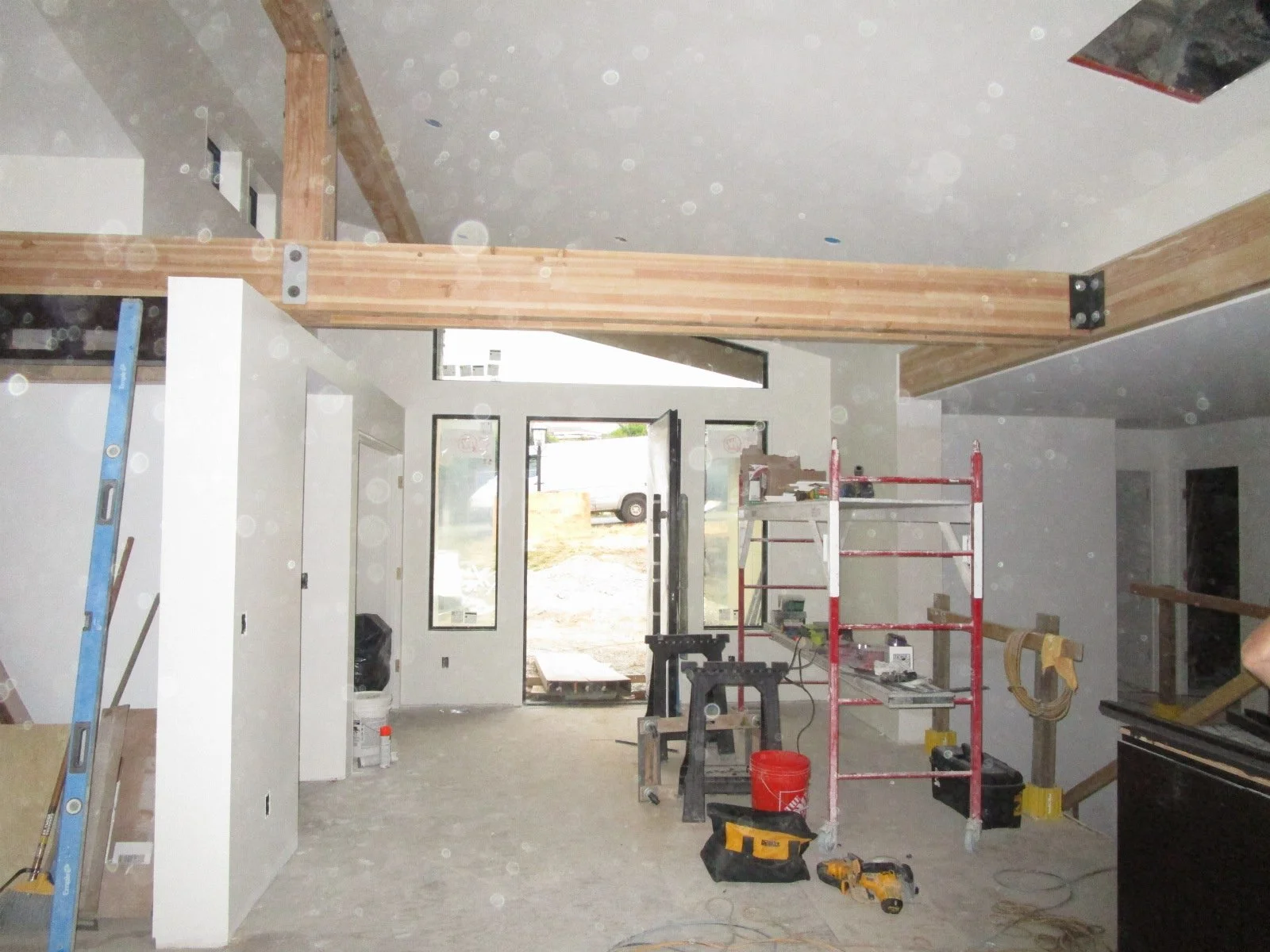Painting has started. Viewing the entryway from the Living Room.