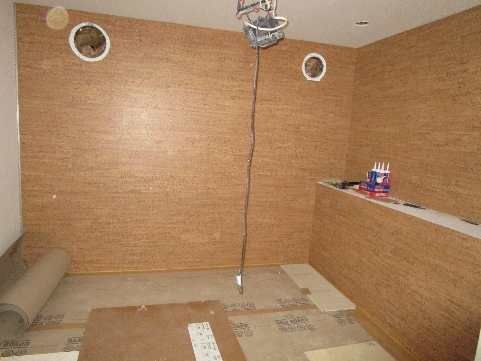 The wine cellar starting to take shape. Cork wall coverings.
