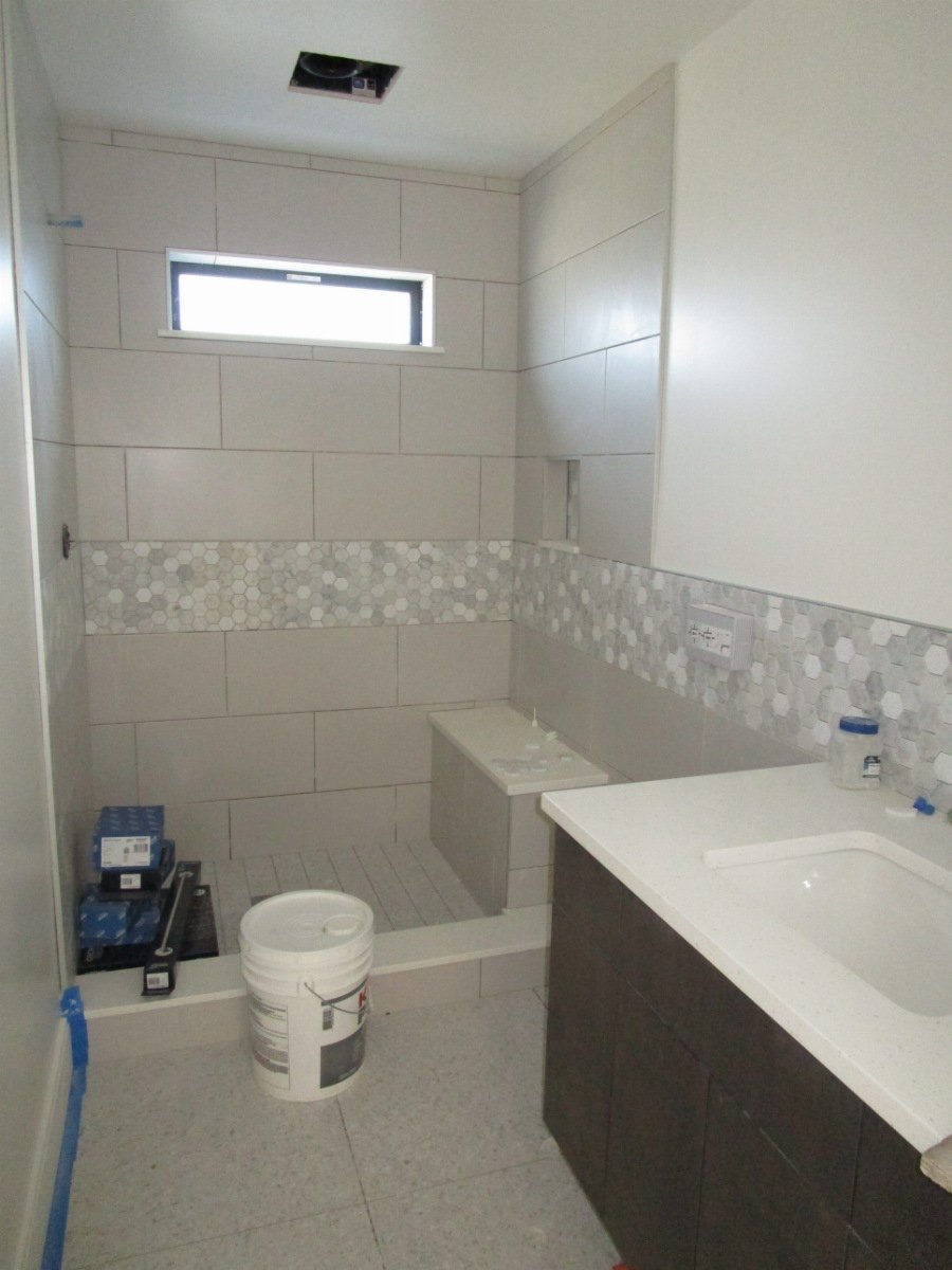 Kids bathrooms almost done with tile work.