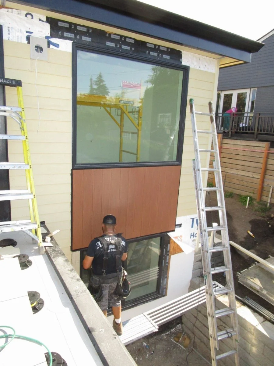 Outside, siding materials continue to go on.