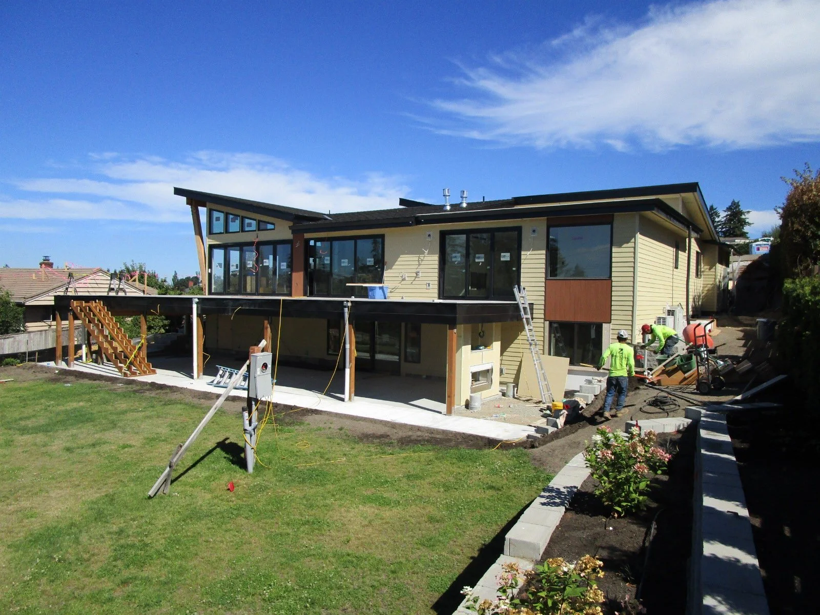 Stairs from the yard up to the deck going in. 