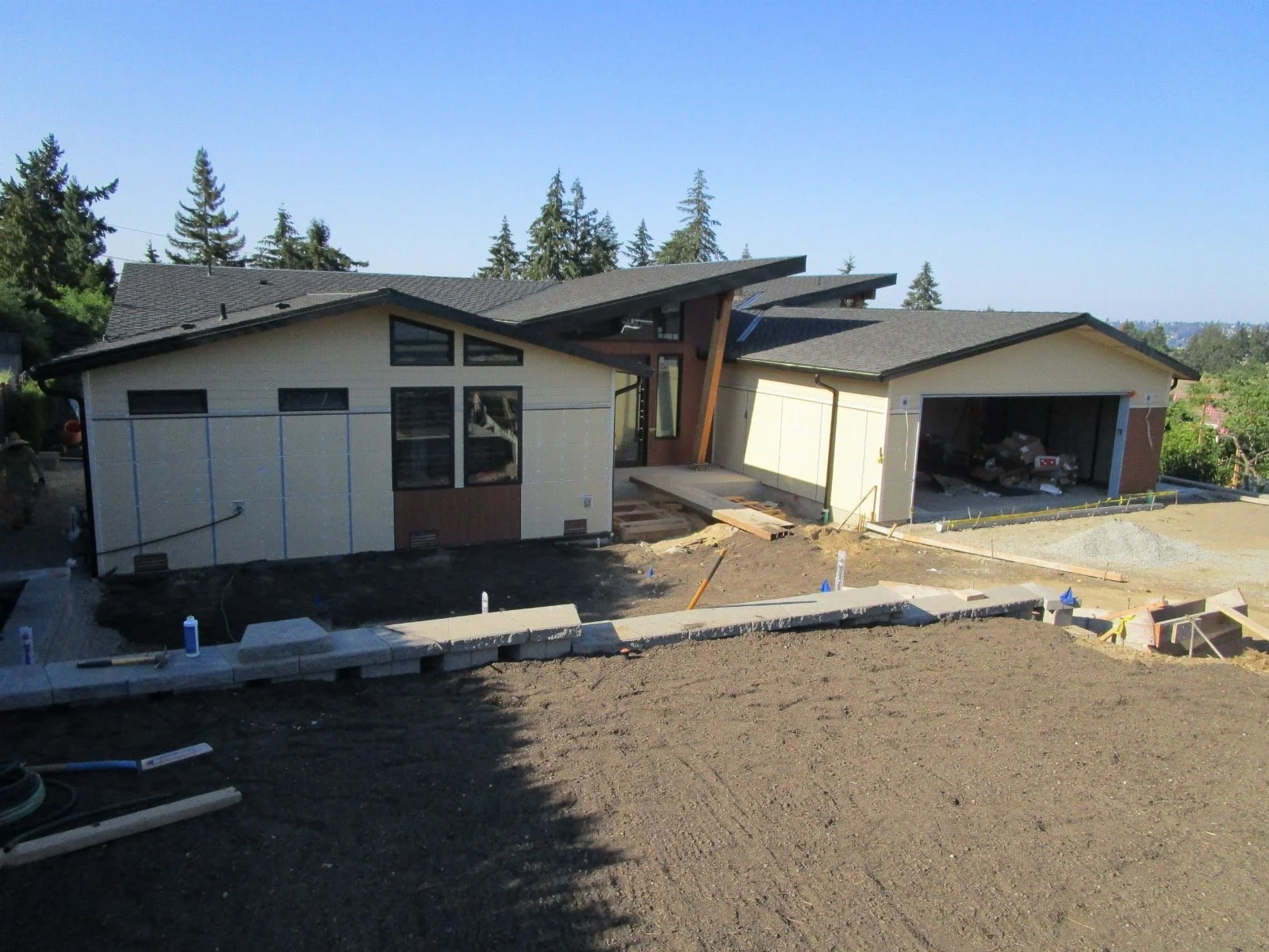 View from the street. Lots of landscaping and paving work happening.