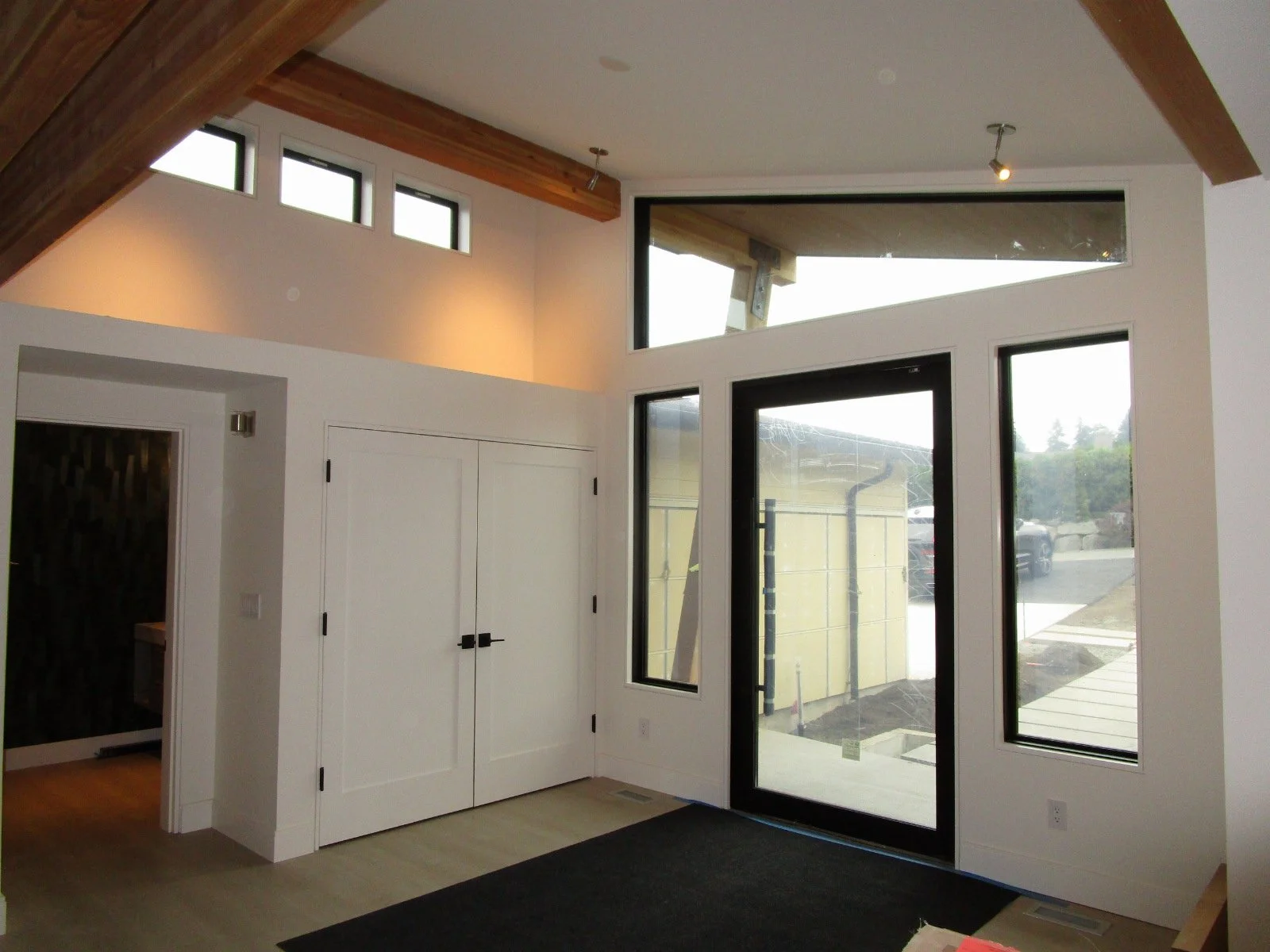 Entryway coming together. Can't quite get all the flying glulams in this shot. A special chandelier is on order.