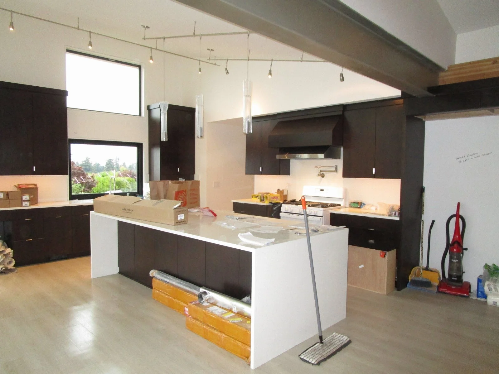 Kitchen starting to come together. Temporary stove to pass inspections.