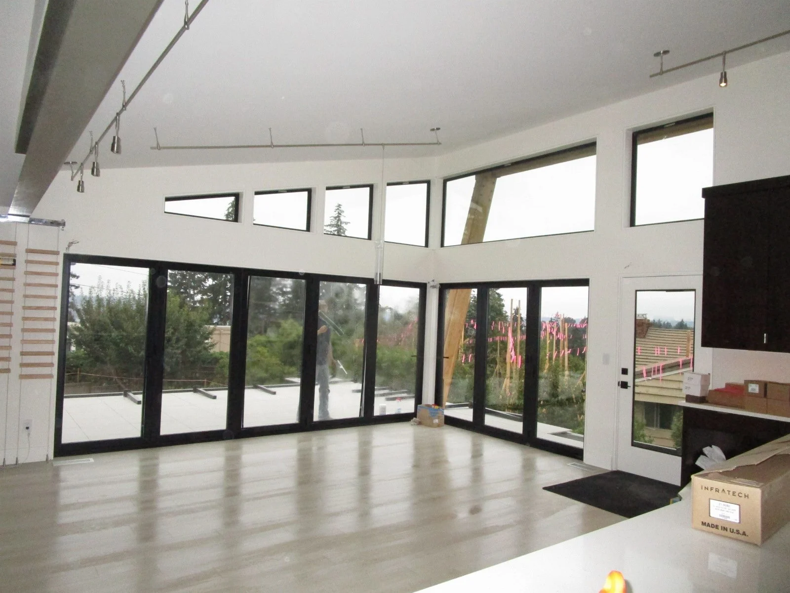 From the kitchen looking over to the dining area. Steel beam upper left for reference.