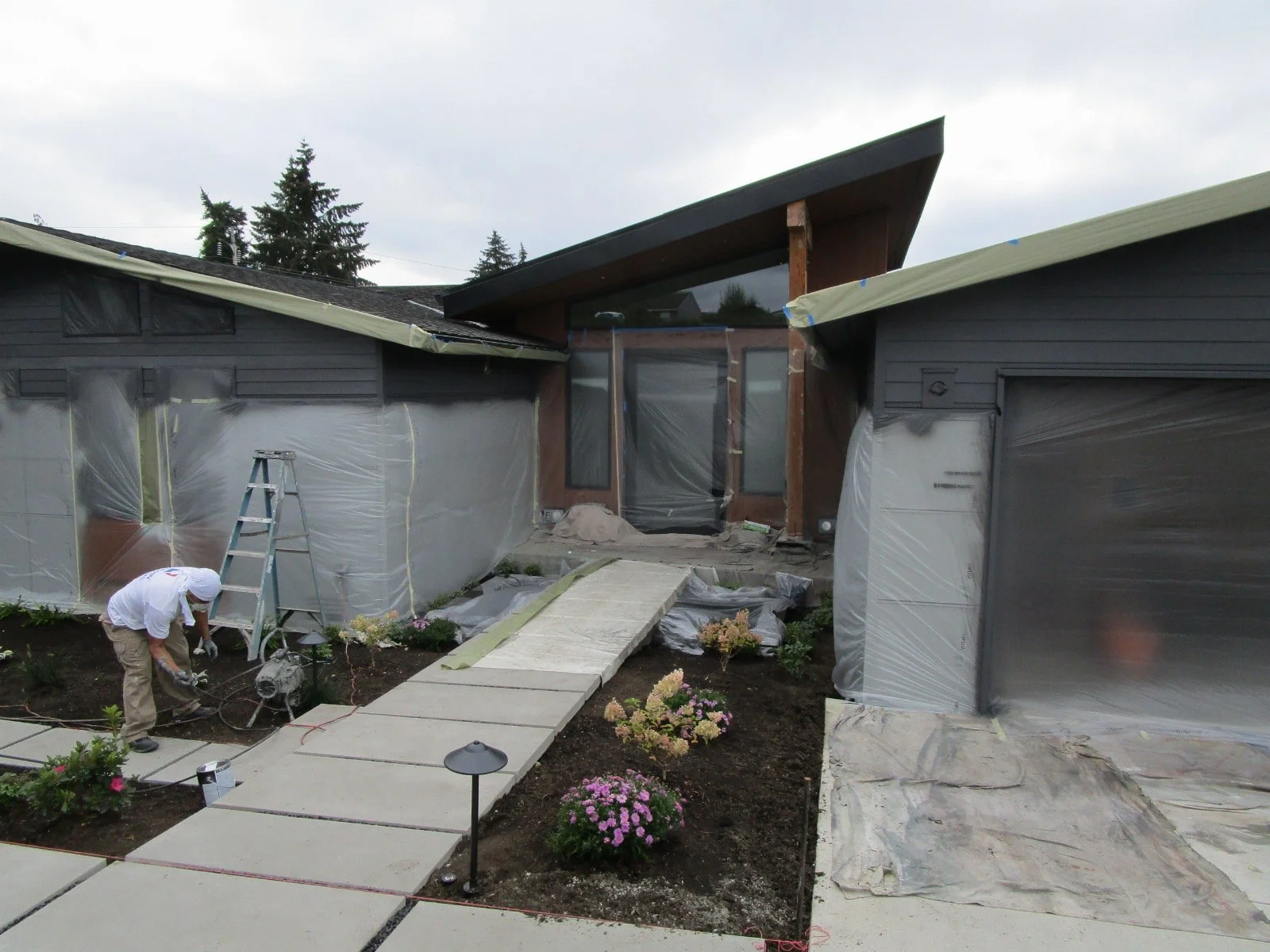 Outside, the painters are getting busy.