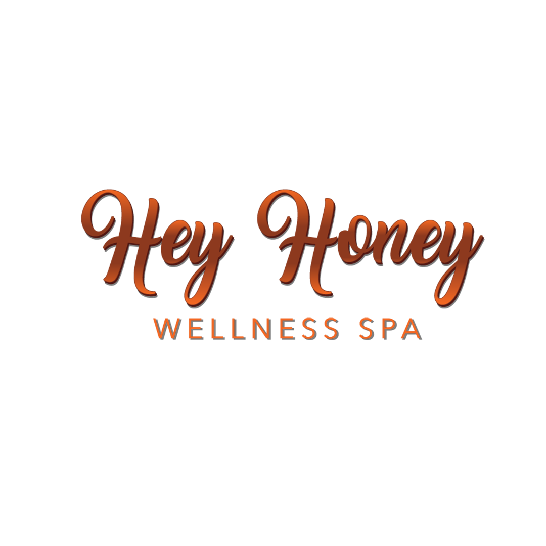 Logo for Hey Honey Wellness Spa with stylized brown text on a black background.