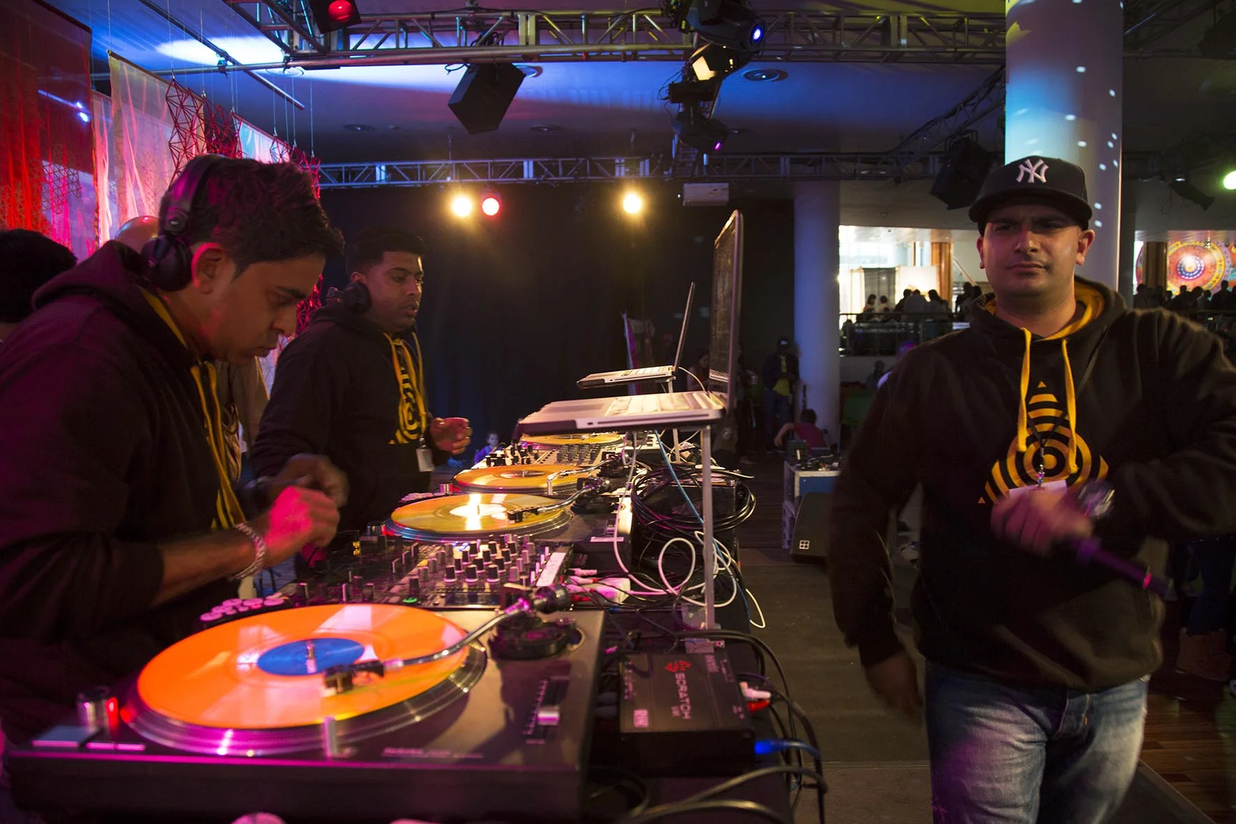 DJ performs for people dancing to Asian music during Alchemy festival.