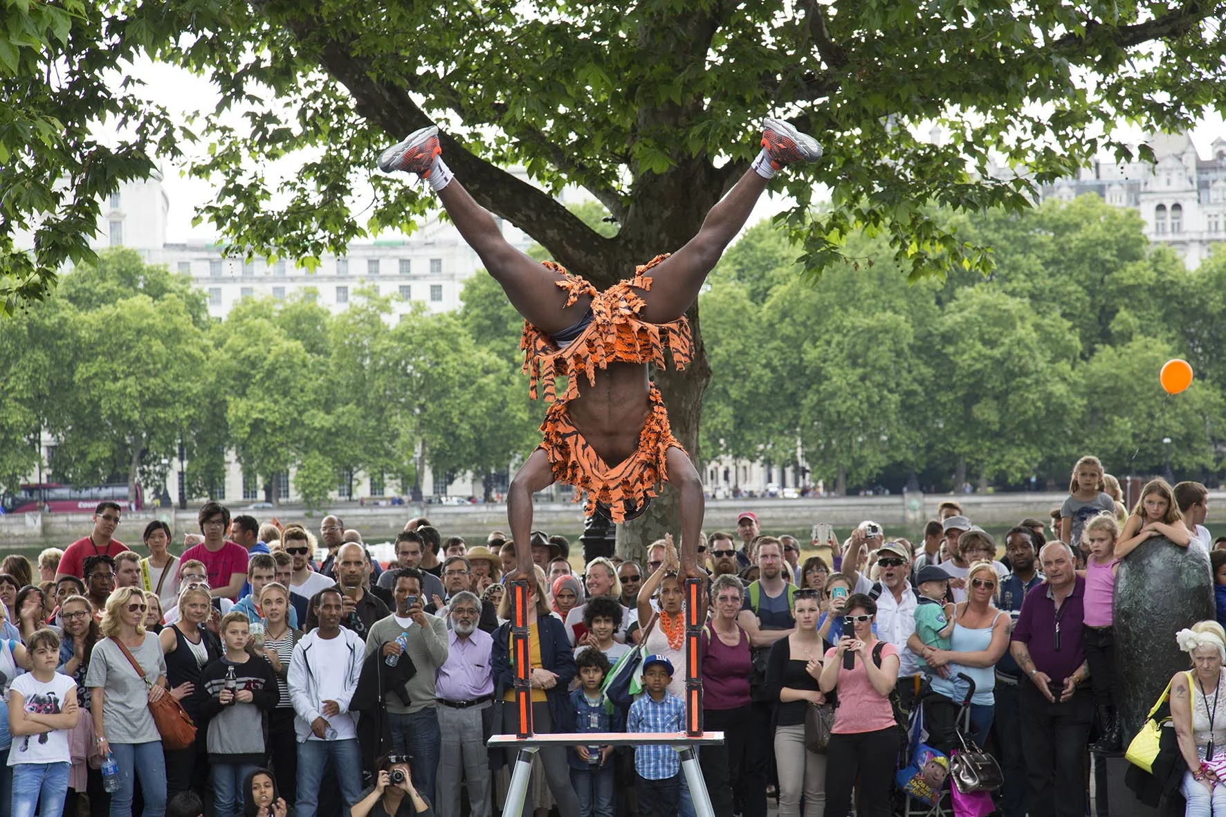 Juma the street performer gathers a crowd.