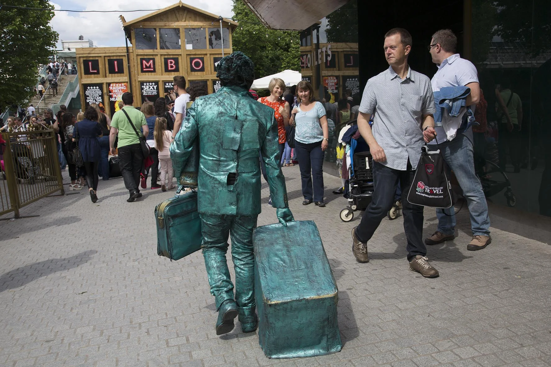 Street performer slipping off for a break.