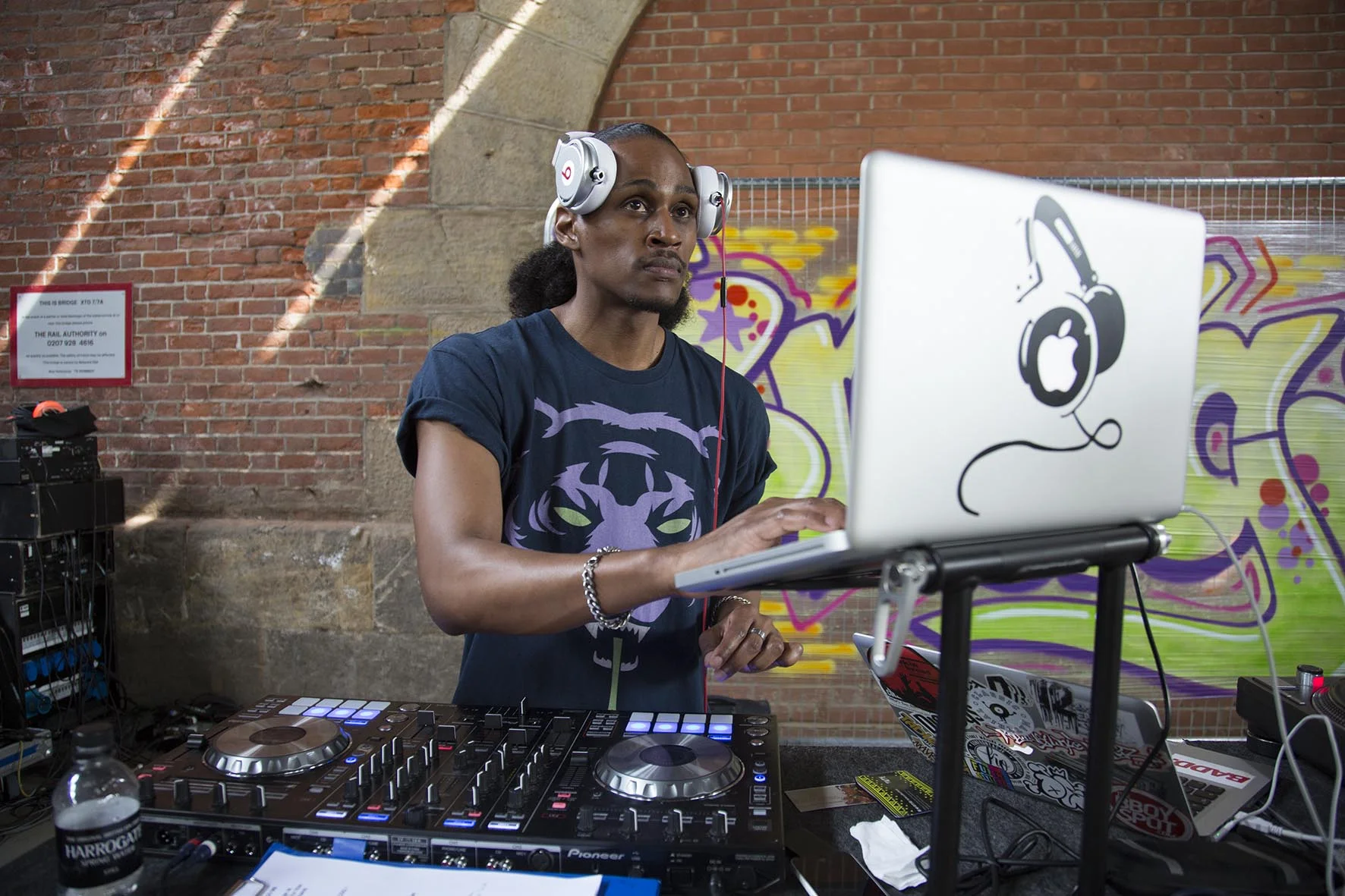 DJ3D lays down the music underneath Hungerford Bridge at the Urban Weekender.