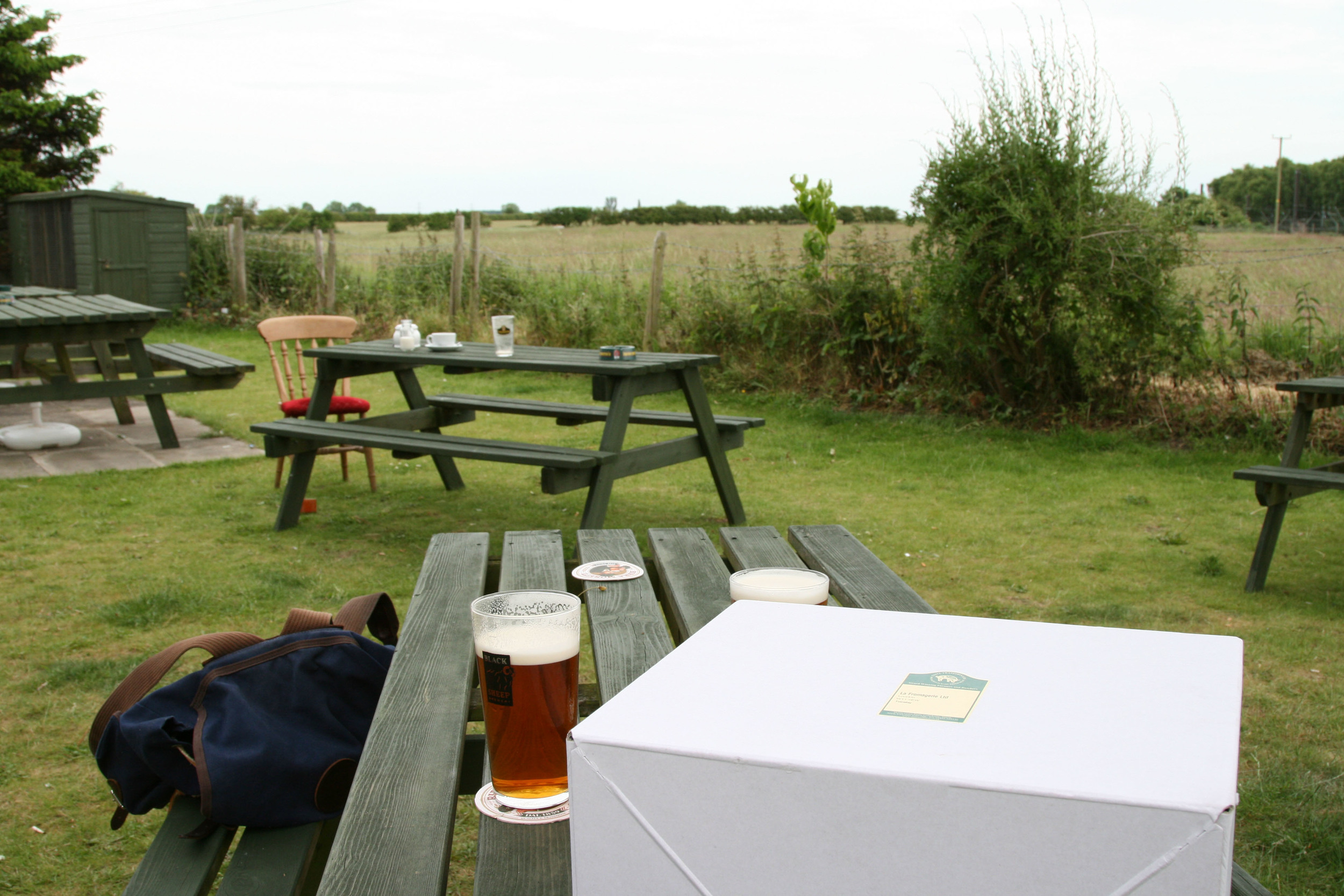 Waiting at the pub for our train, box of lamb chops in the foreground.