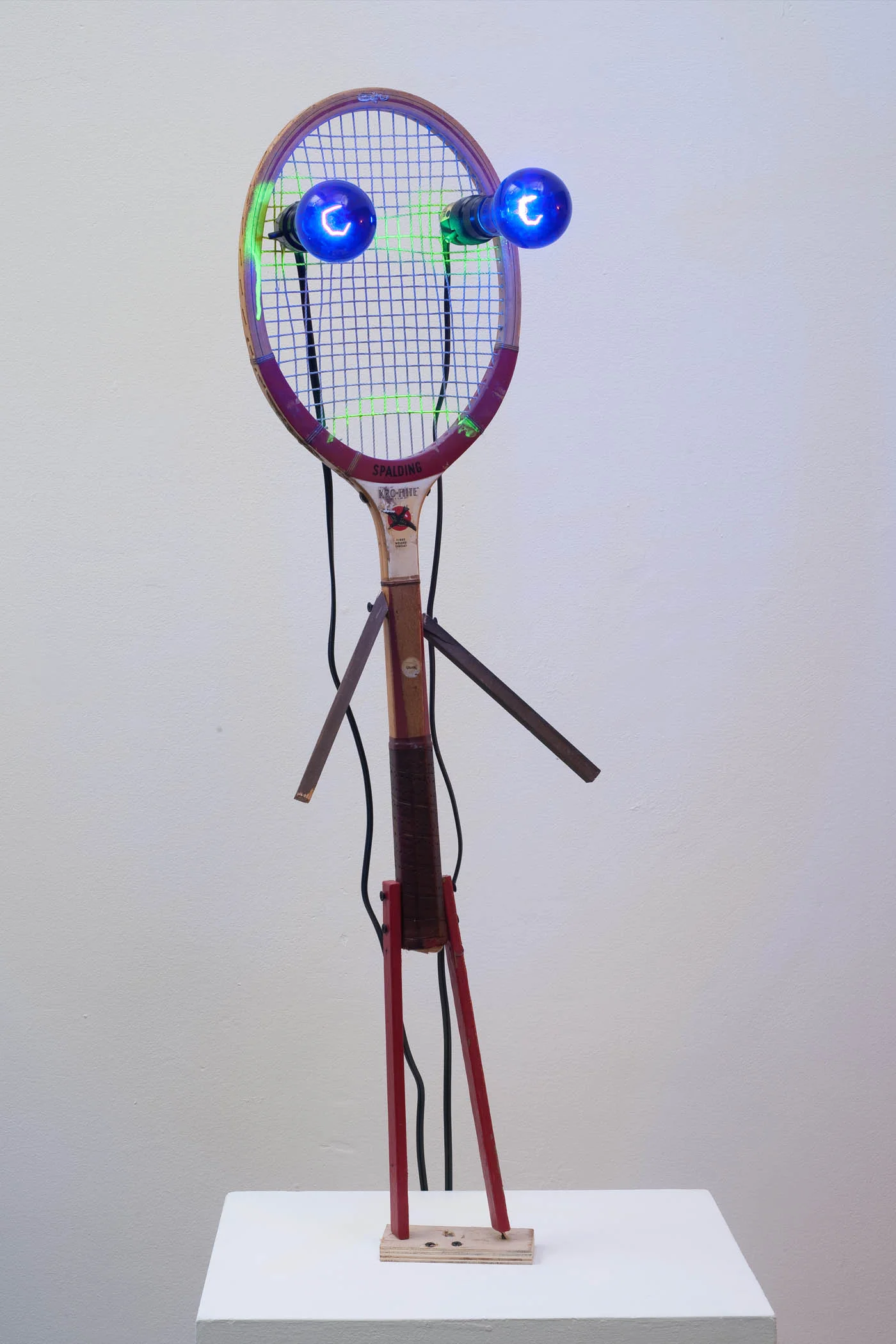 Jon Pylypchuk, "and without further ado, we would like to introduce spaulding king of fucks" 2011, mixed media, tennis racket, black lights, 36"x10"x7"