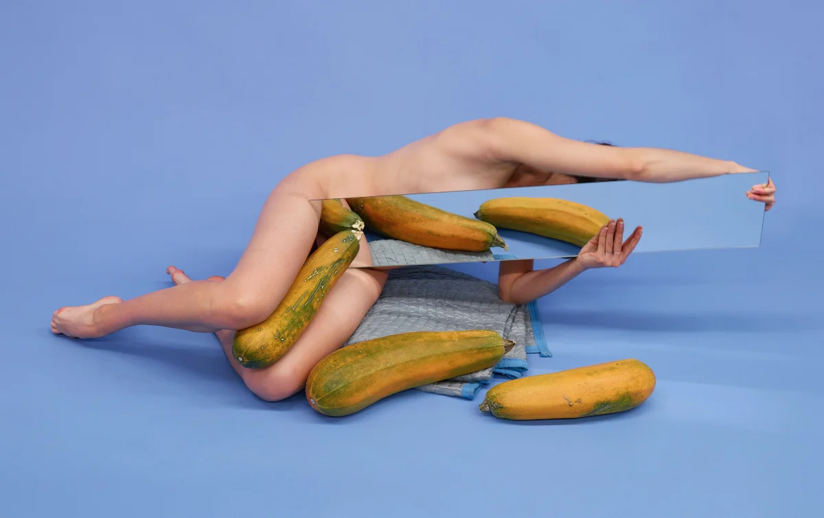 Untitled (Reaching with three squashes on blue), 2017 Pigment print 20 x 32 inches