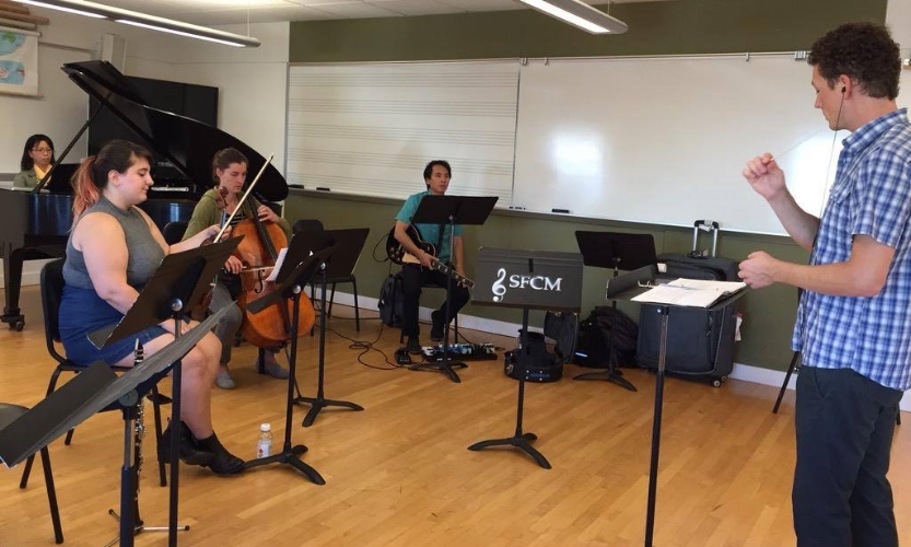 A photo from the rehearsal of From Dreams, We Emerge .