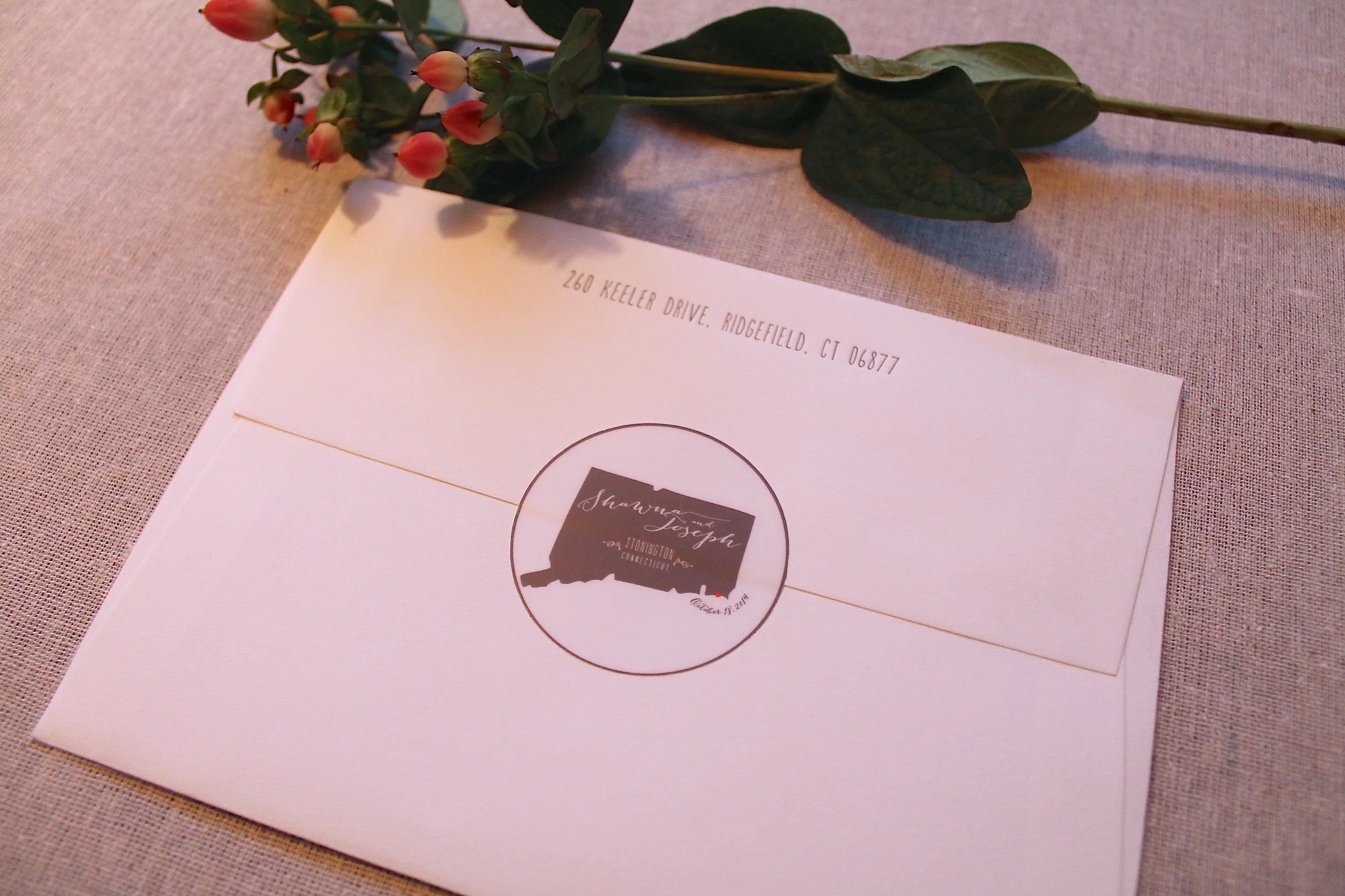 Each Save the Date was sealed with a custom wedding logo decal.