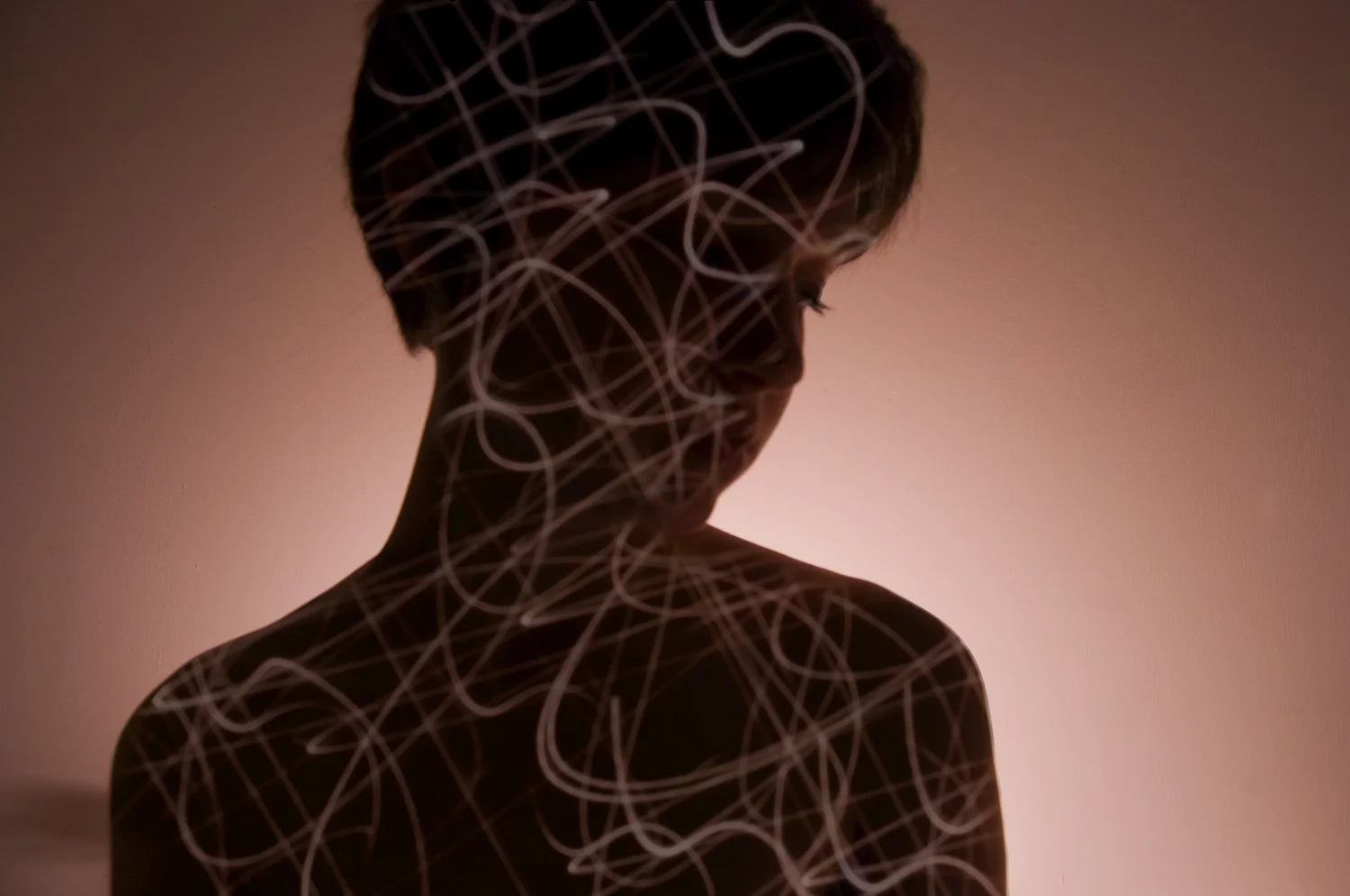 Rebecca Wind, Rebecca (self portrait), Inkjet Print, 18" x 12", 2010 Project: Students were asked to create a series of photographs that built upon the concepts and techniques learned in the class. This project combined backlit portraits with long exposure light drawings. This print was one of a series of four. This work was created in Photographic Digital Imaging at Wells College.