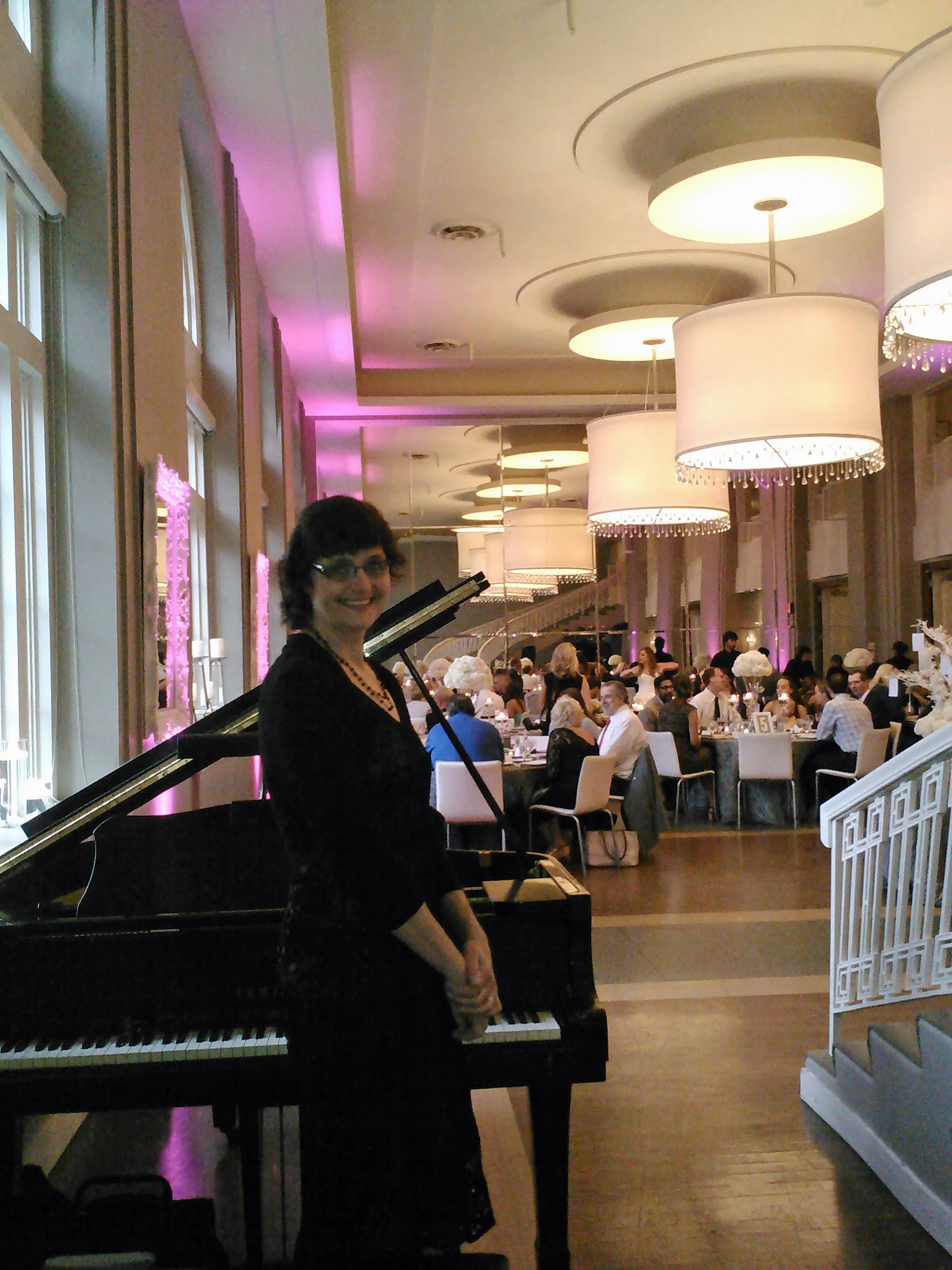 Sharon loved creating a romantic musical atmosphere on the grand piano for the newly married couple and their guests in the Boulevard Room at the Calhoun Beach Club.