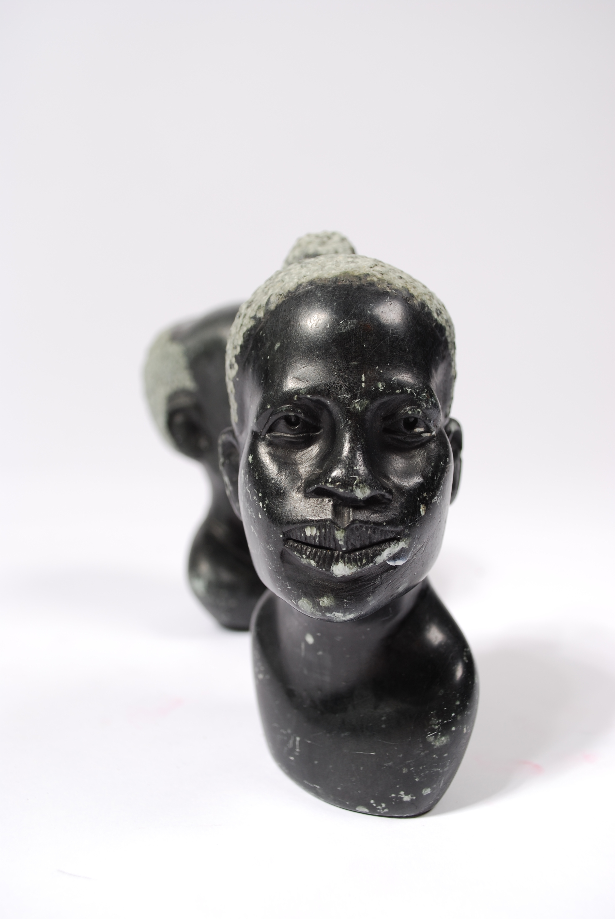 Stone curving head man and woman, marble, 50's