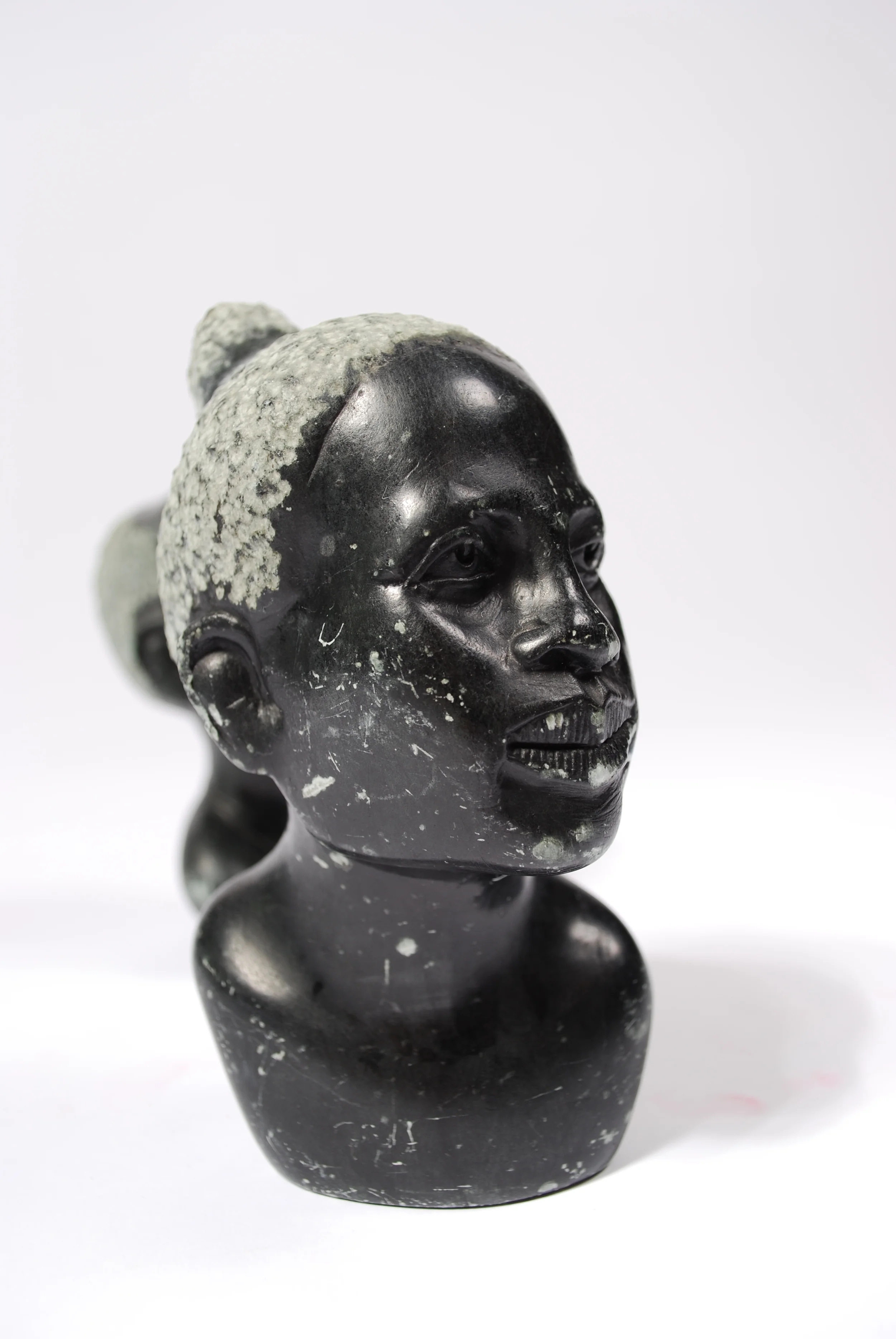 Stone curving head man and woman, marble, 50's