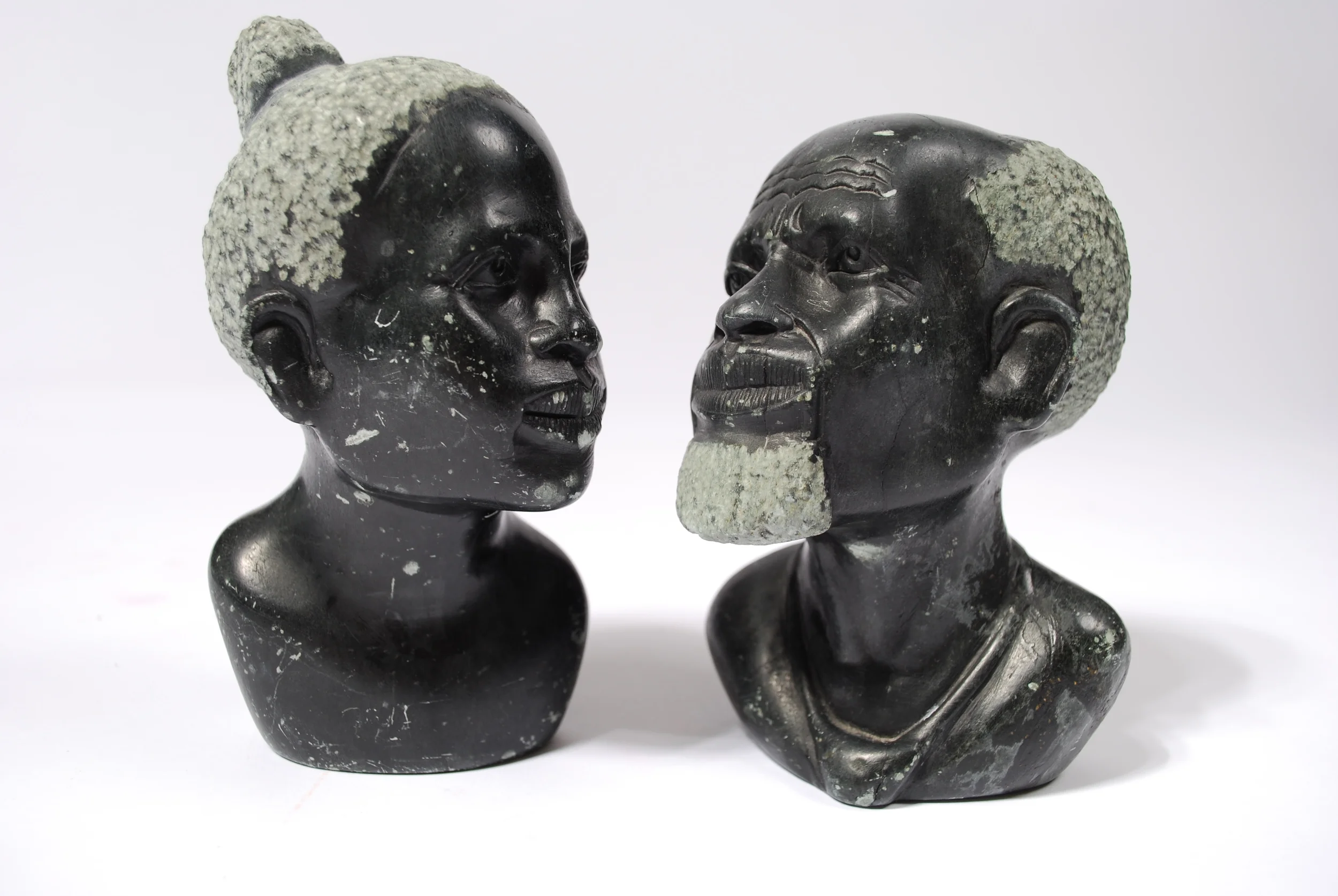 Stone curving head man and woman, marble, 50's