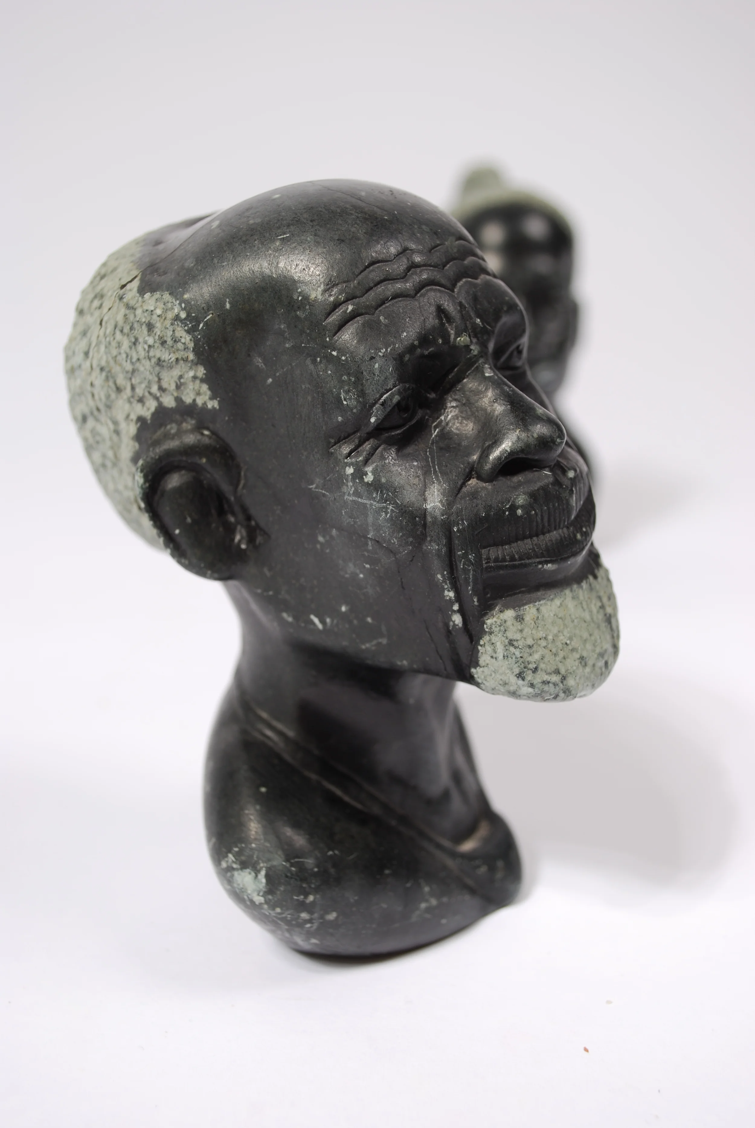 Stone curving head man and woman, marble, 50's