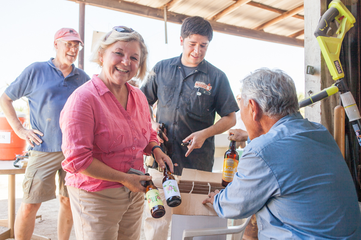 The folks at Bruery Terreux made a batch of sour beer with the nectarines from the Masumoto Family Farm. Here, Marcy proudly displays some of the samples they brought for the Masumotos.