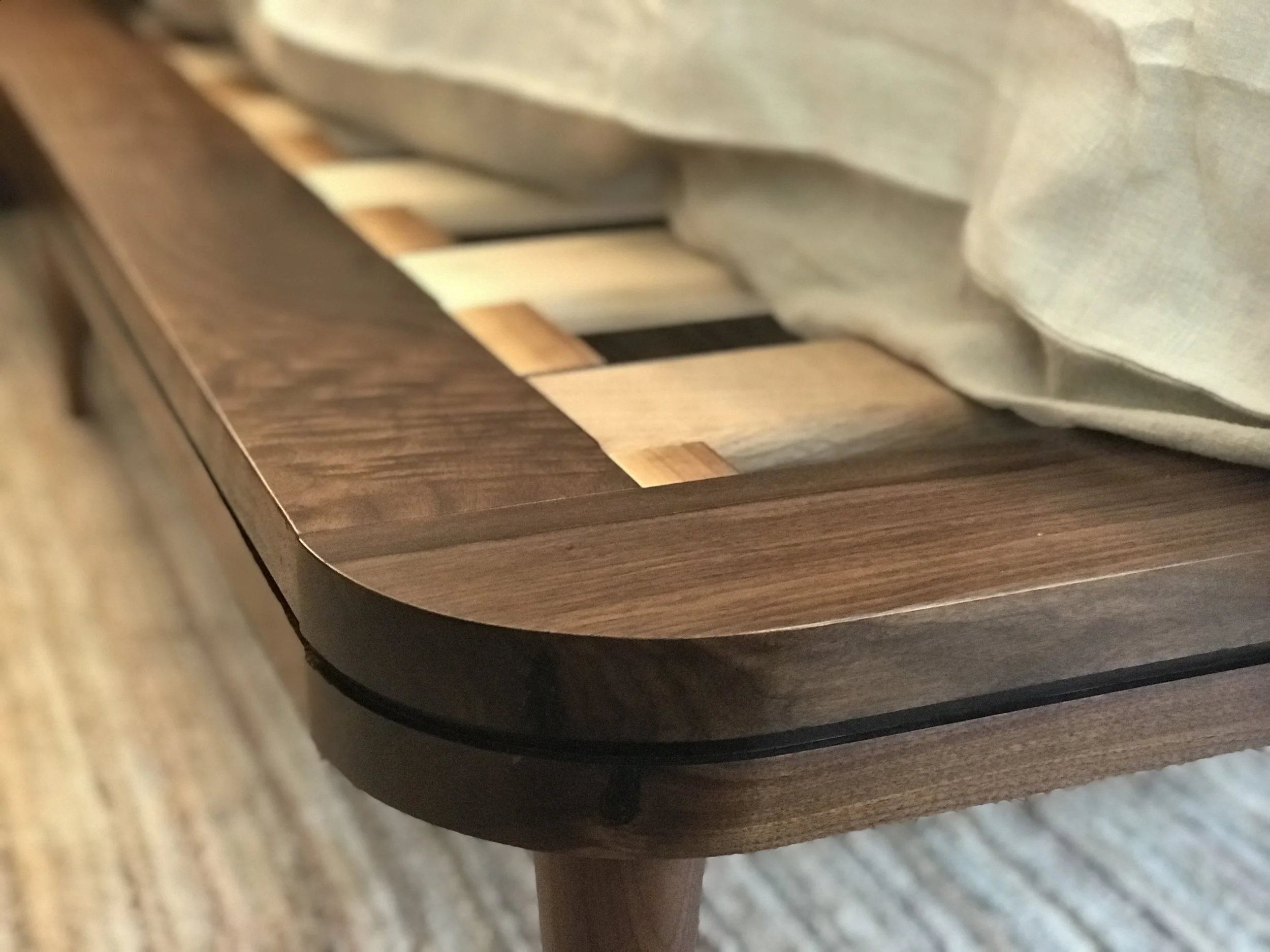 The Jack Ellis Company - Custom Walnut bed detail