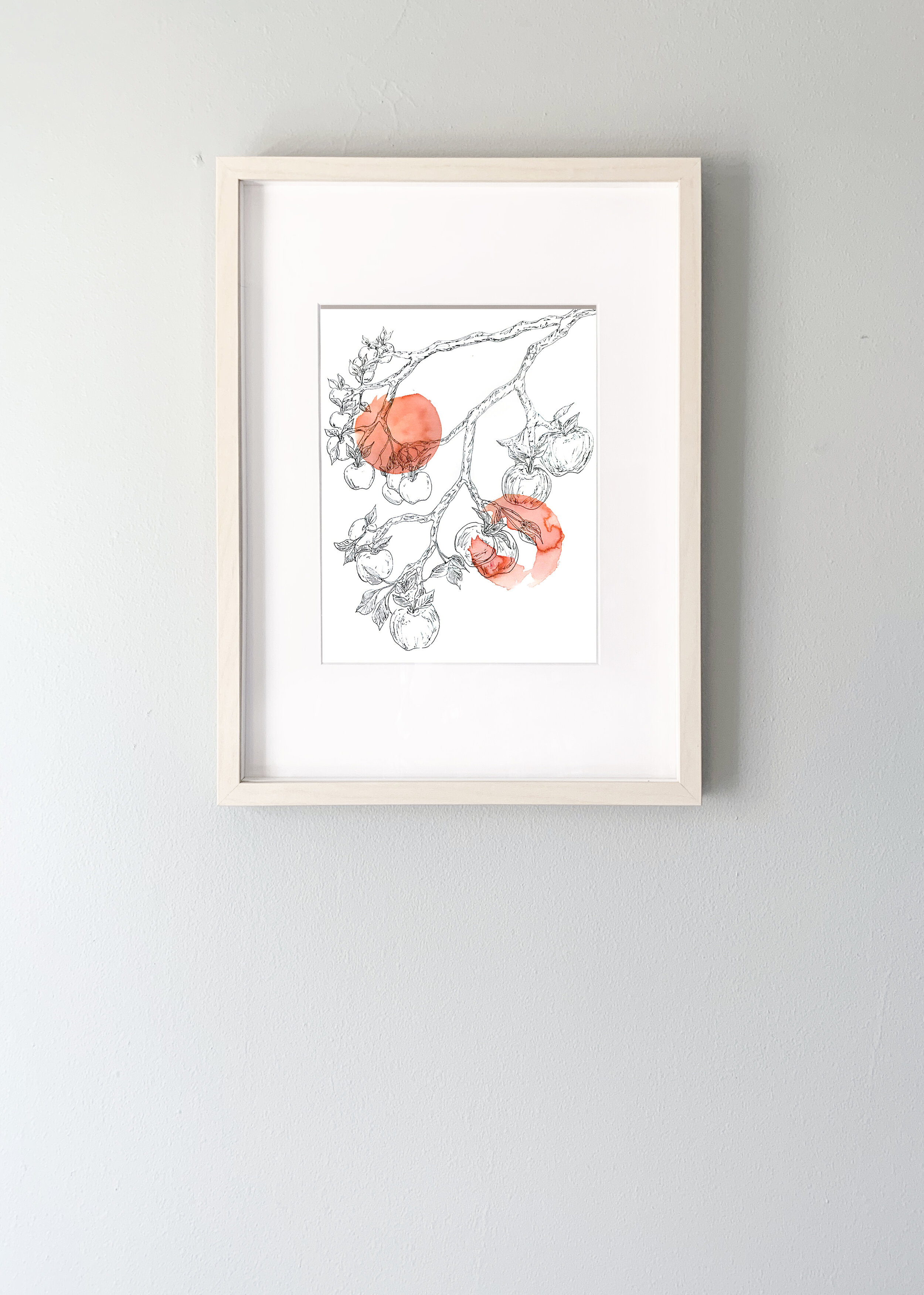 Line drawing of an apple tree over red circles of ink