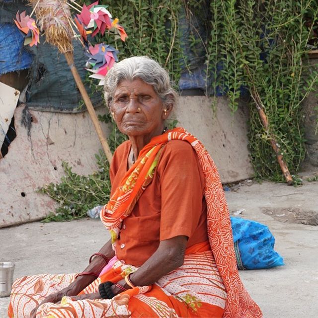 A regal elder from the fishing village chatting with other women #regal #women #fishingvillage #urbexphotography #street