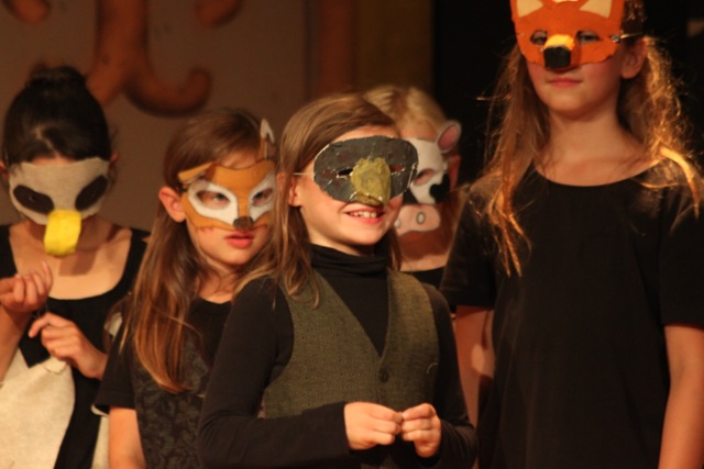 In 2014 students got to make their own animal masks during art time, and we used them in the show