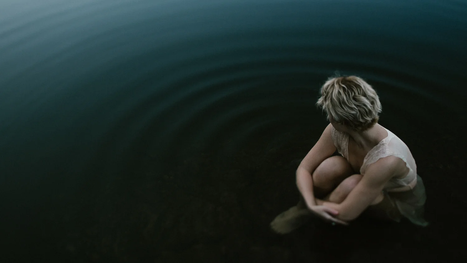 Portrait of women sitting in Thetis Lake, Victoria Boudoir photographer