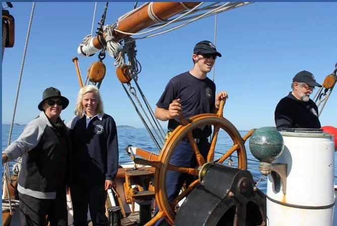 boy helming and youth on voyage.jpg
