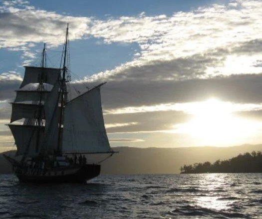 Ship sailing away at sunset.jpg