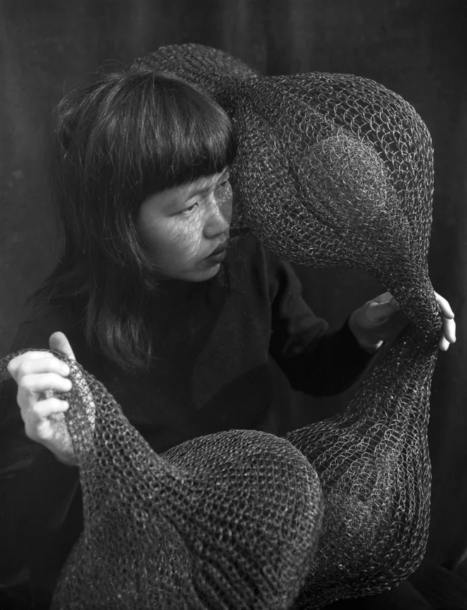 Ruth Asawa Holding a Form-Within-Form Sculpture, 1952