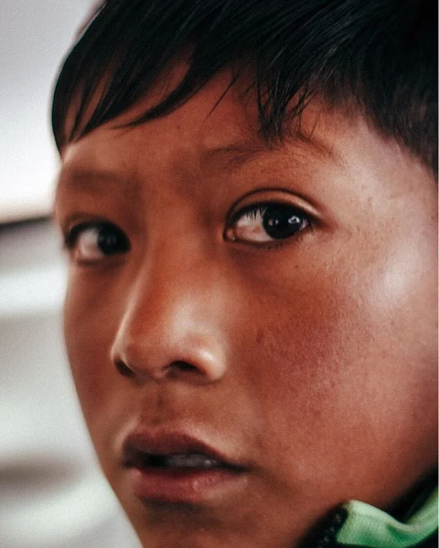 Lil guy I met taking photos at sunrise in Urubamba, Peru. He was on his way to deliver some tools for his sister at 6 am so I offered him a ride in the mototaxi I had booked. We chatted and took a candid photo of him. He didn&rsquo;t seem unhappy, bu