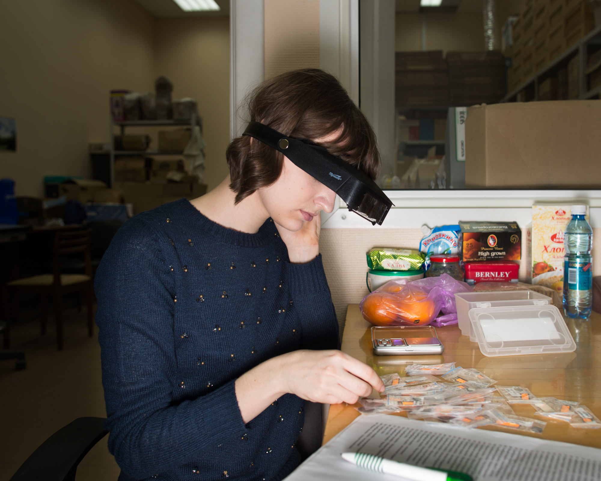 Institutes of the Russian Academy of Sciences surround the incubator. Academics there study everything from science to humanities. Anna Bolshakova, a numismatist, reviews ancient Slavic coins she collected during a field expedition for her studies at the Institute of Archaeology.