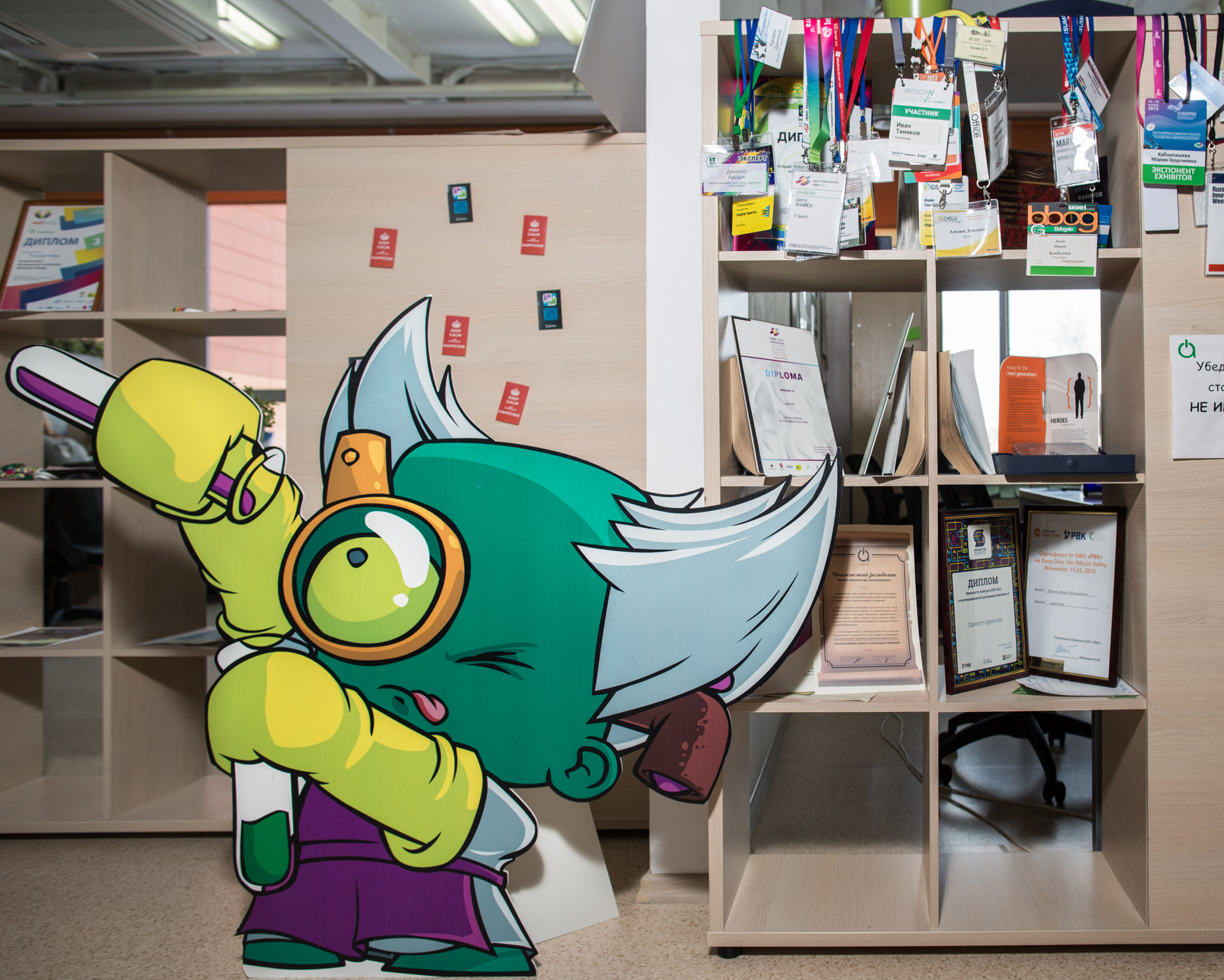 A cardboard cutout of a character for a mobile video game created by Playtox, an Akadempark startup, stands in the main incubator office space of the towering main building.