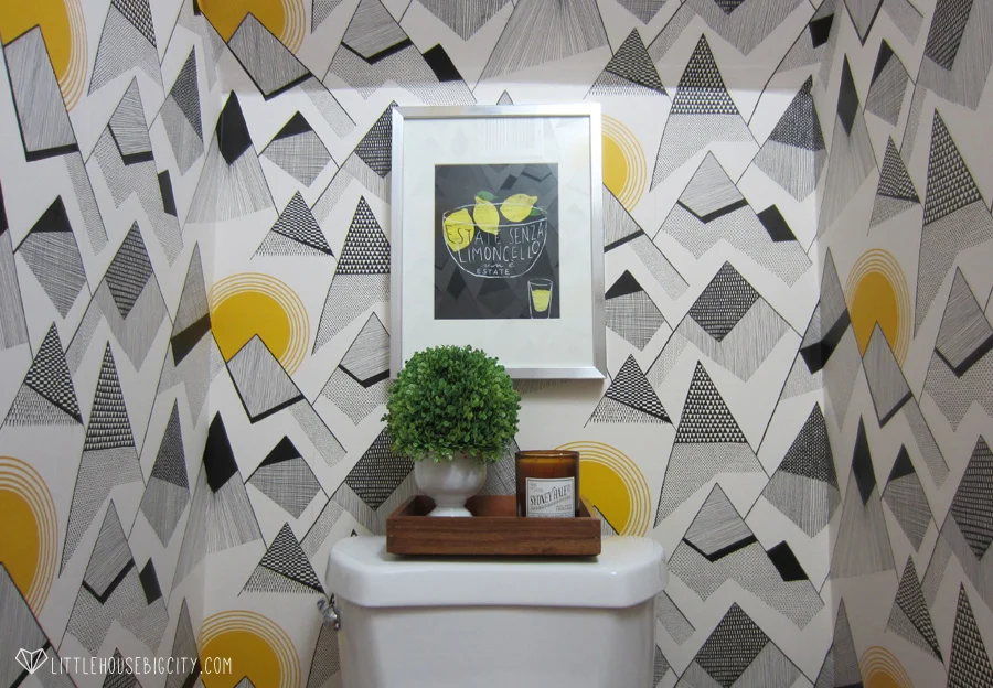 Mountains by Missprint wallpaper makes this powder room pop