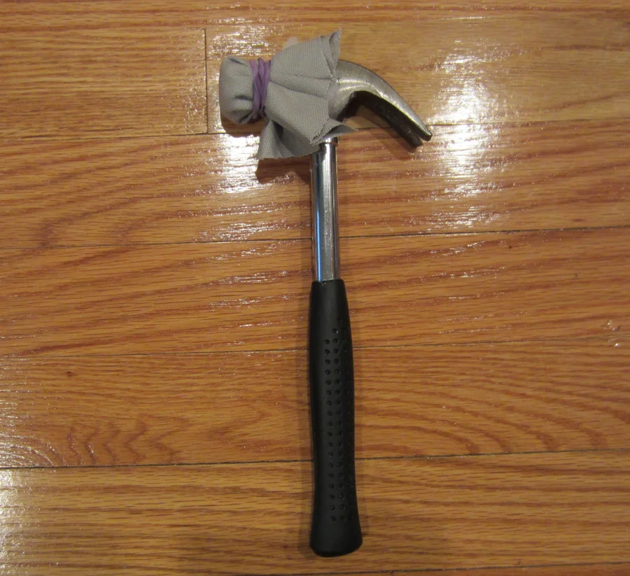 Instead of buying a rubber mallet, I jerry-rigged a hammer using batting, canvas and a rubber band