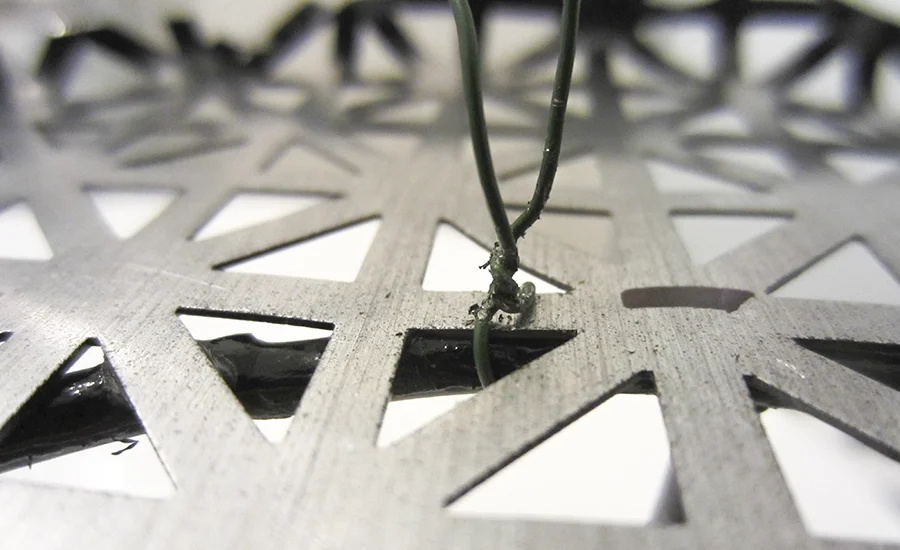 Step 5: Use pliers to tightly twist the wire
