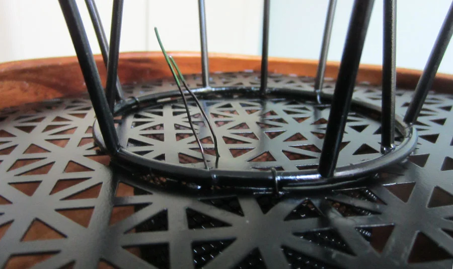 A close up of the wire that I colored black and used to secure the lamp shade base to the paperclip cup/wooden bowl.