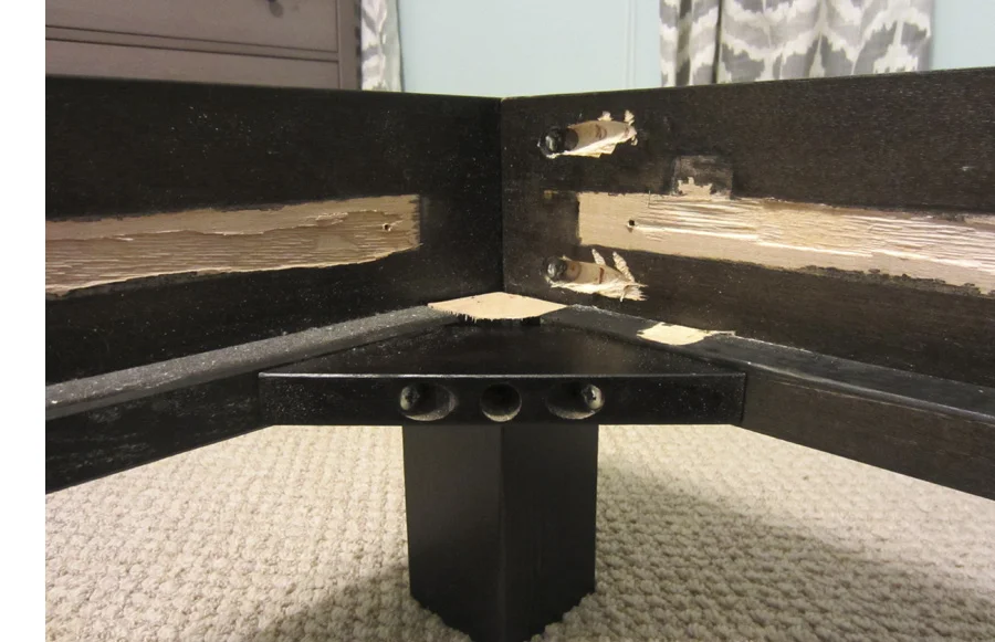 Corner of the frame – you can see the mess we made of the veneer by moving the wood strip.