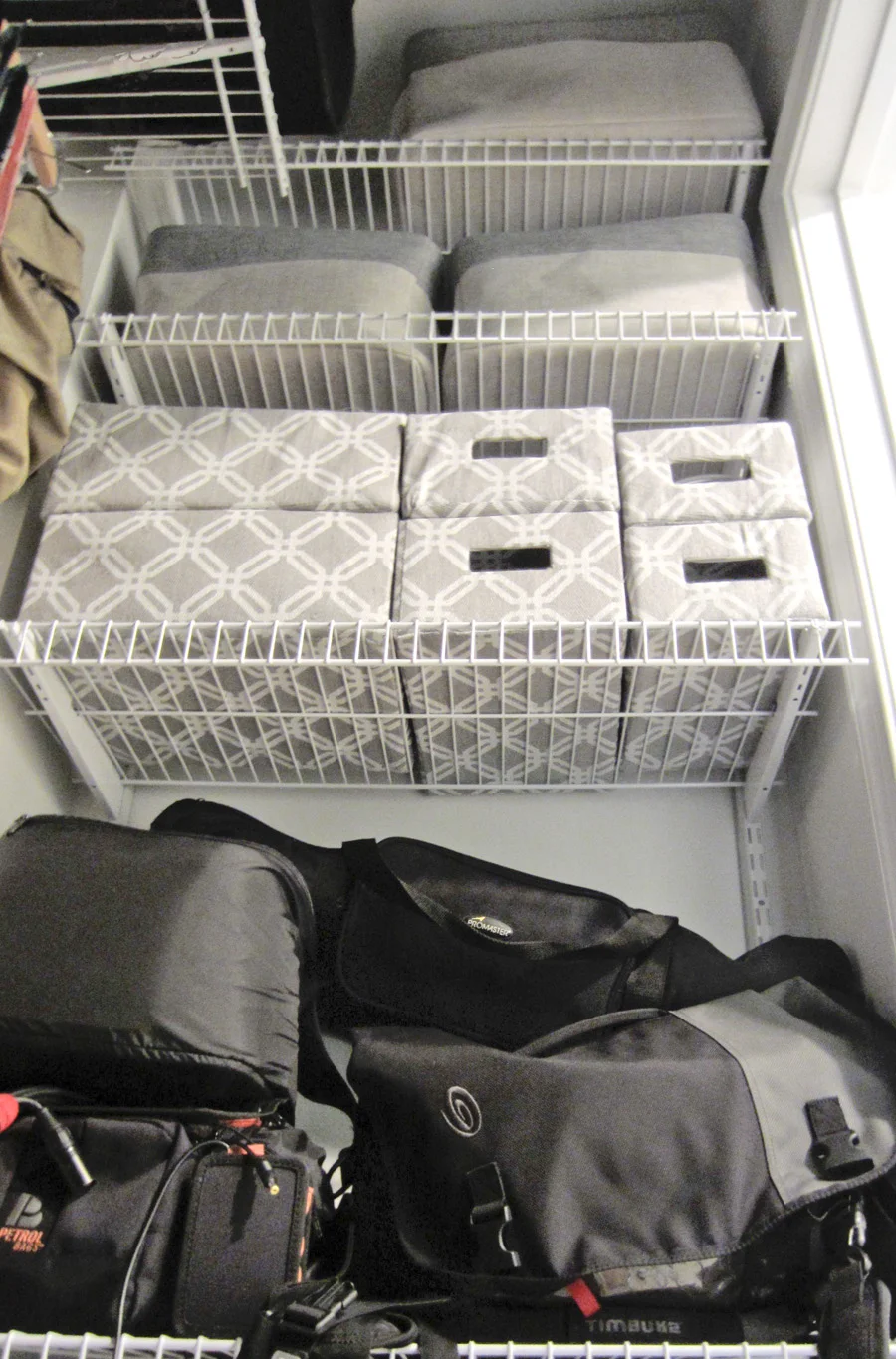 Eli's camera gear is organized in bins and bags
