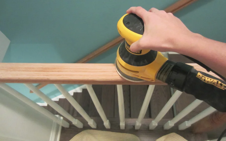I used the DeWalt orbital hand sander to remove most the finish on the stairwell
