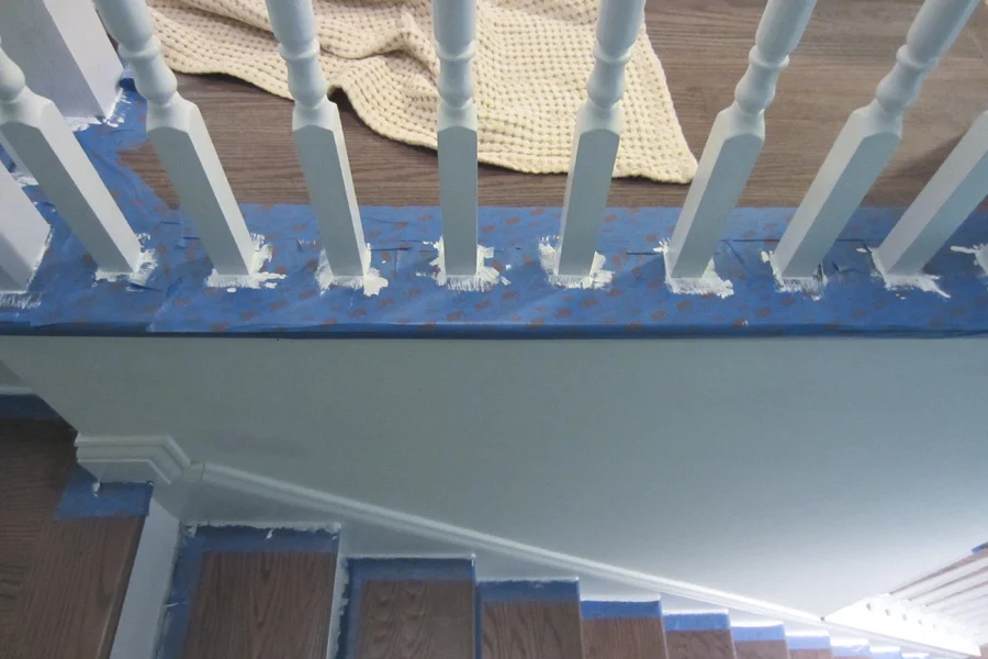 I touched up the base of the balusters and around the stair treads